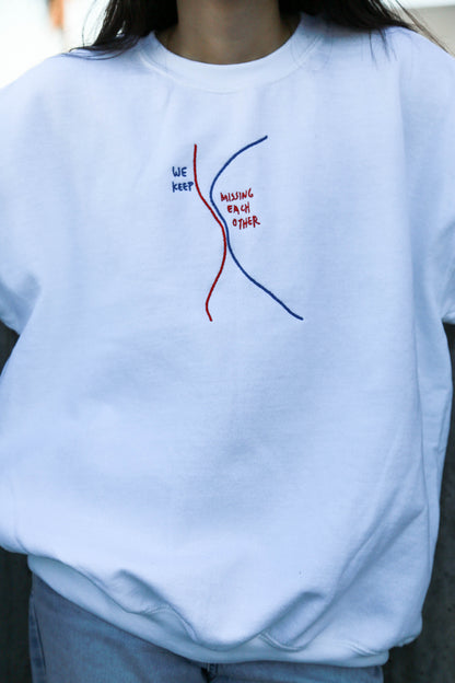We Keep Missing Each Other Embroidered Crewneck